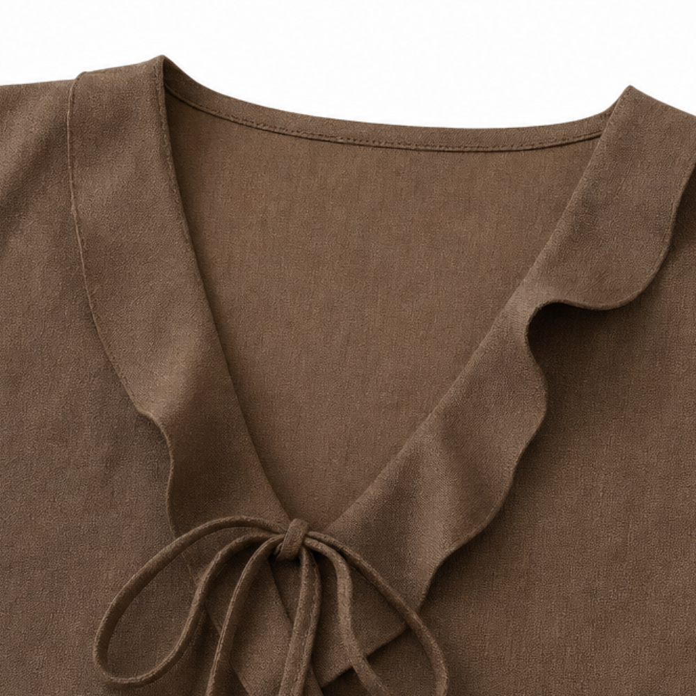 Vellara – Sleeveless Ruffle V-Neck Blouse with Bow Tie and Peplum Hem