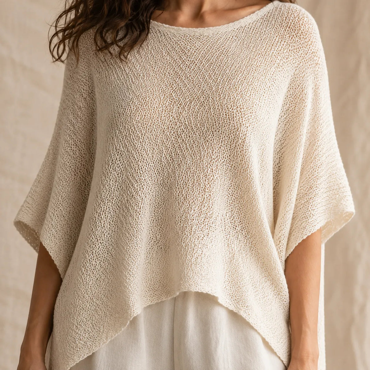 Solvera – Open Knit Batwing Top with Asymmetric Hem