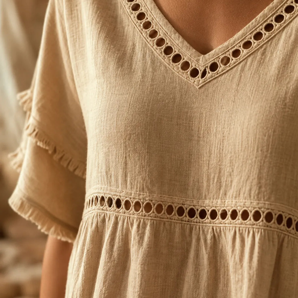 Meloria – Bohemian Babydoll Top with Eyelet Cutouts and Fringe Hem