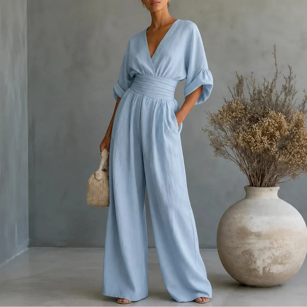 Soléra – Wide Leg V Neck Jumpsuit with Pleated Waist Sash